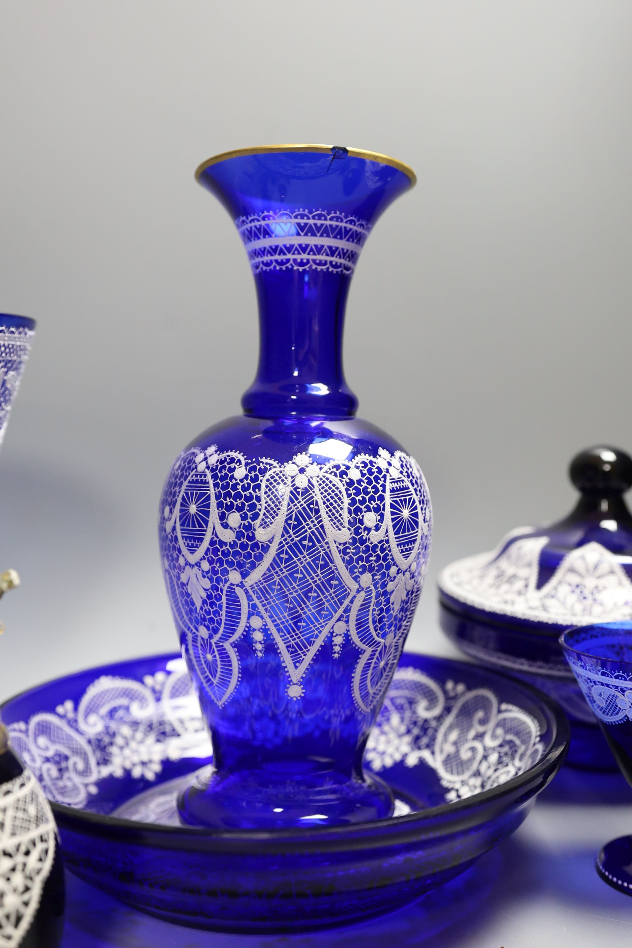 A group of Venetian Lace pattern enamelled blue glass, including a goblet, a vase etc (7)